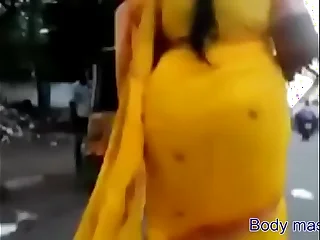 Rekha aunty's heavy ass denunciatory in yellow saree porn video